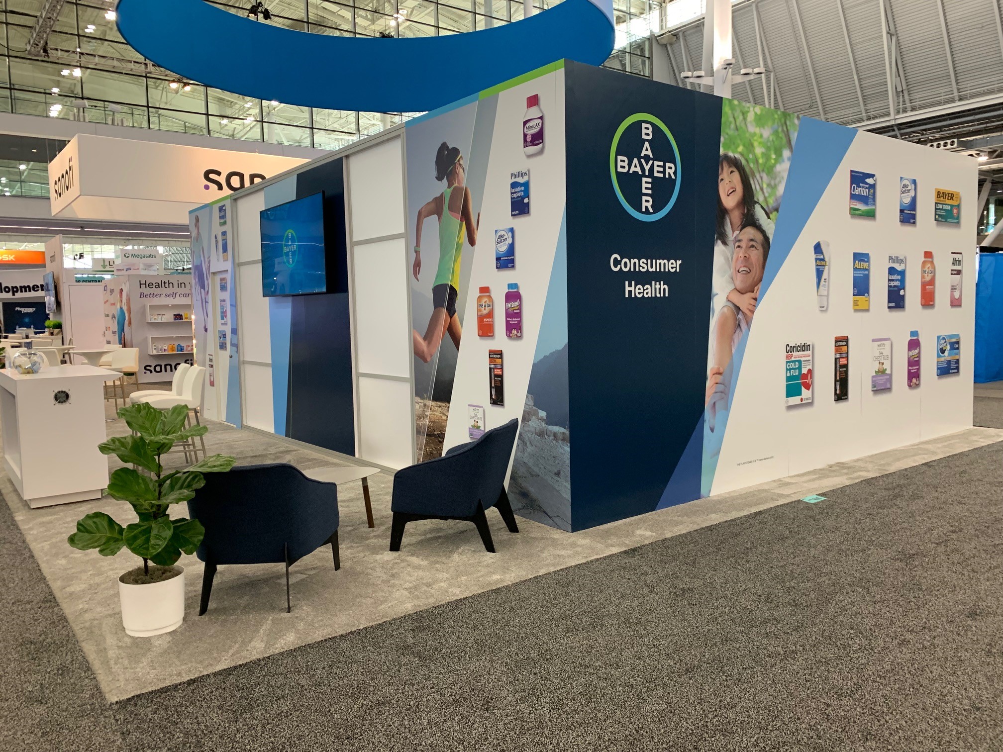 Completed booth — full environmental graphic wall with Bayer product portfolio